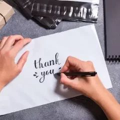 Customer appreciation hands write thank you note