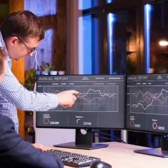 two colleagues working late office blue light night view1