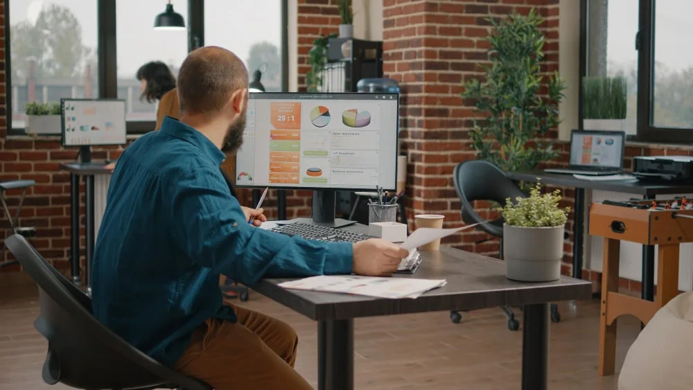 entrepreneur looking papers computer with rate charts plan project presentation business man working with data analysis information create marketing strategy min