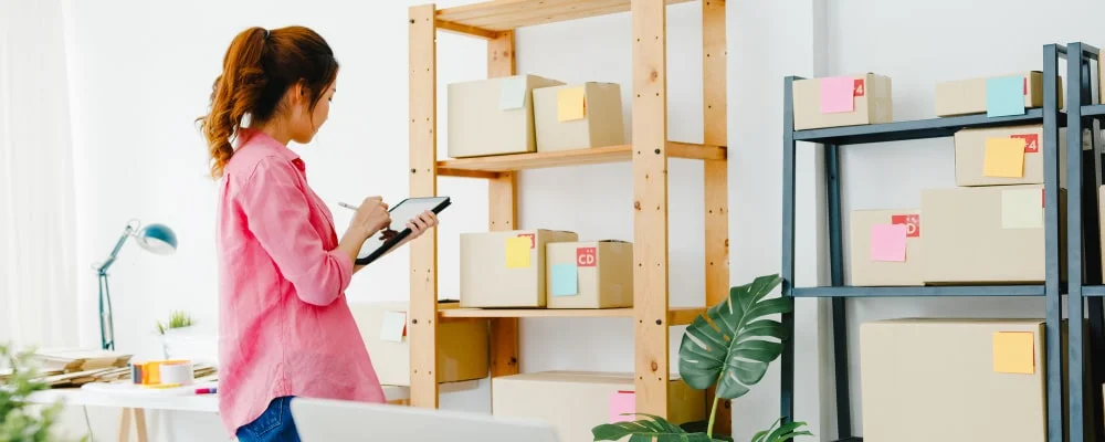 young asia entrepreneur businesswoman check product purchase order stock save tablet computer work home office small business owner online market delivery lifestyle freelance concept min