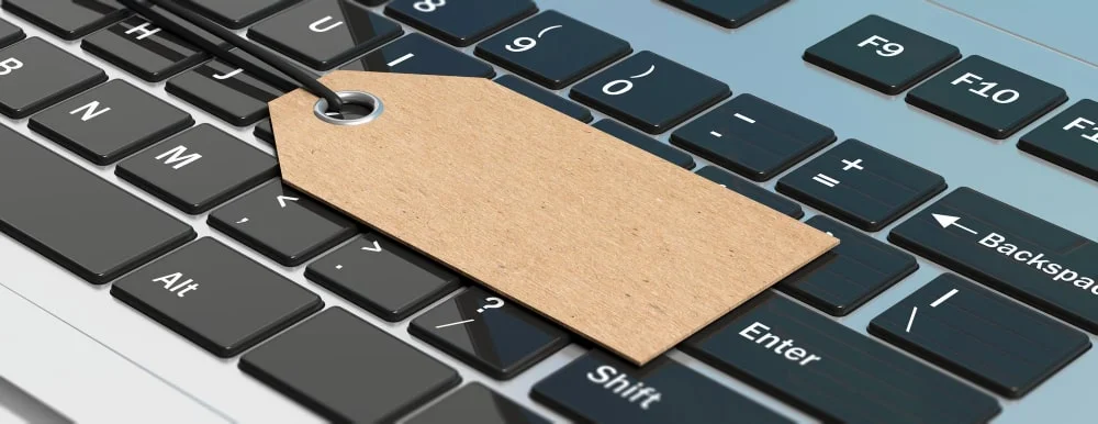 blank paper gift tag computer laptop keyboard banner 3d illustration min